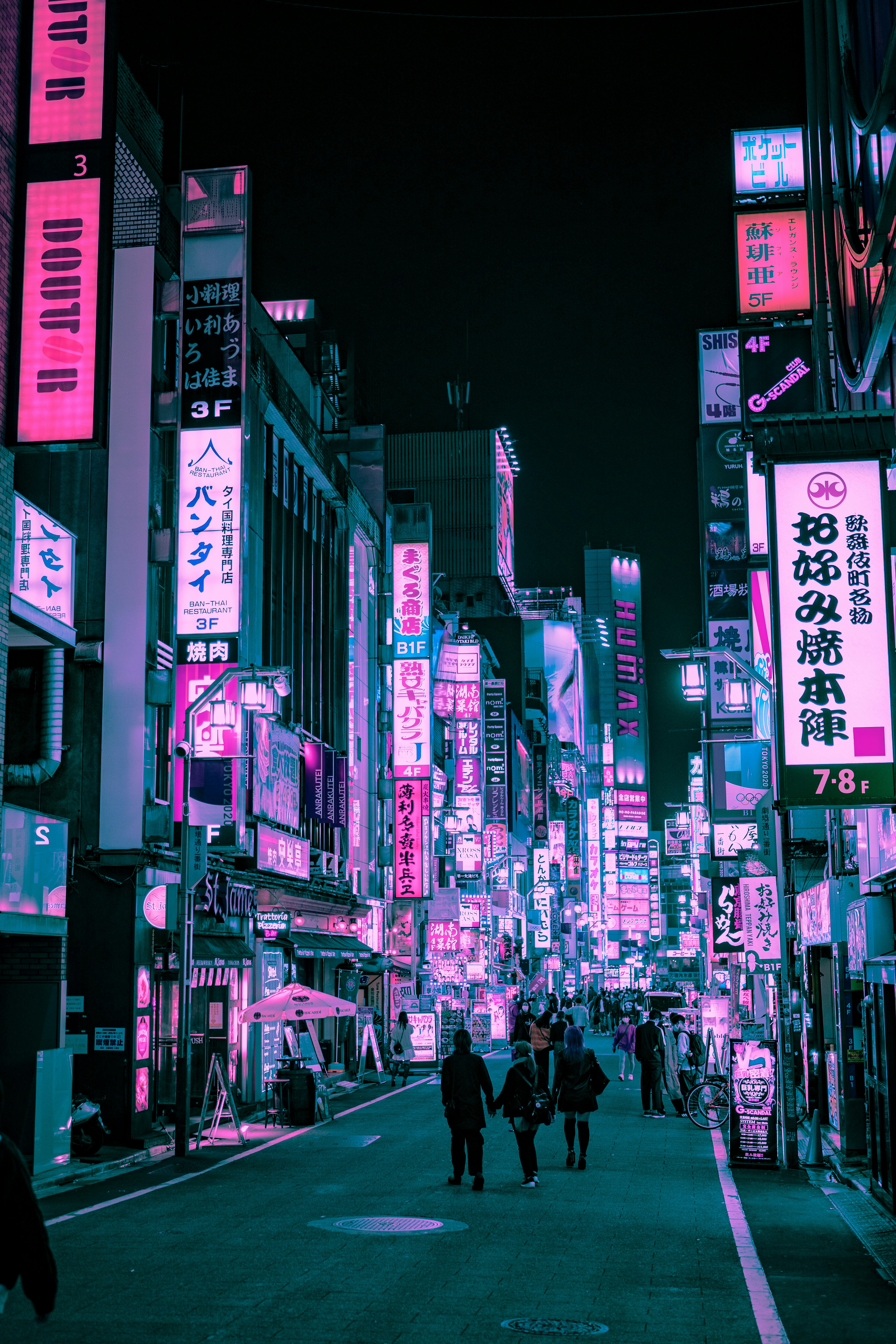 people walking on street during night time