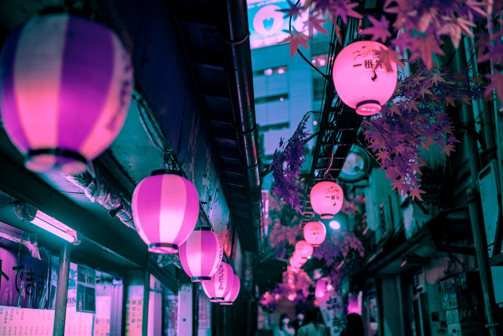 pink and white balloons on a street