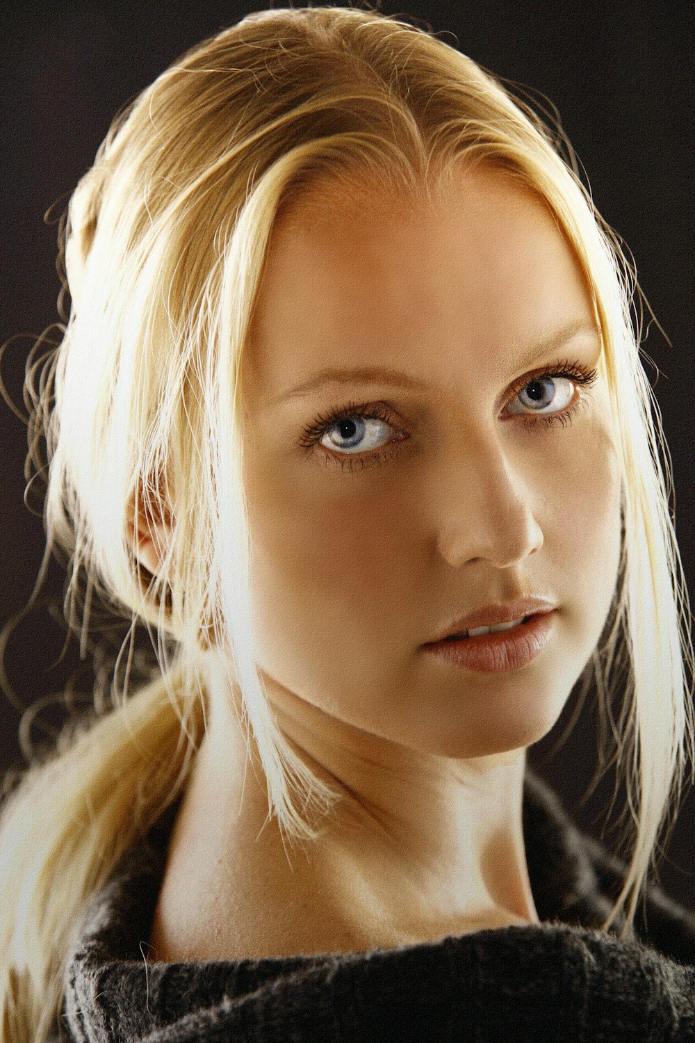 woman with blonde hair and white shirt