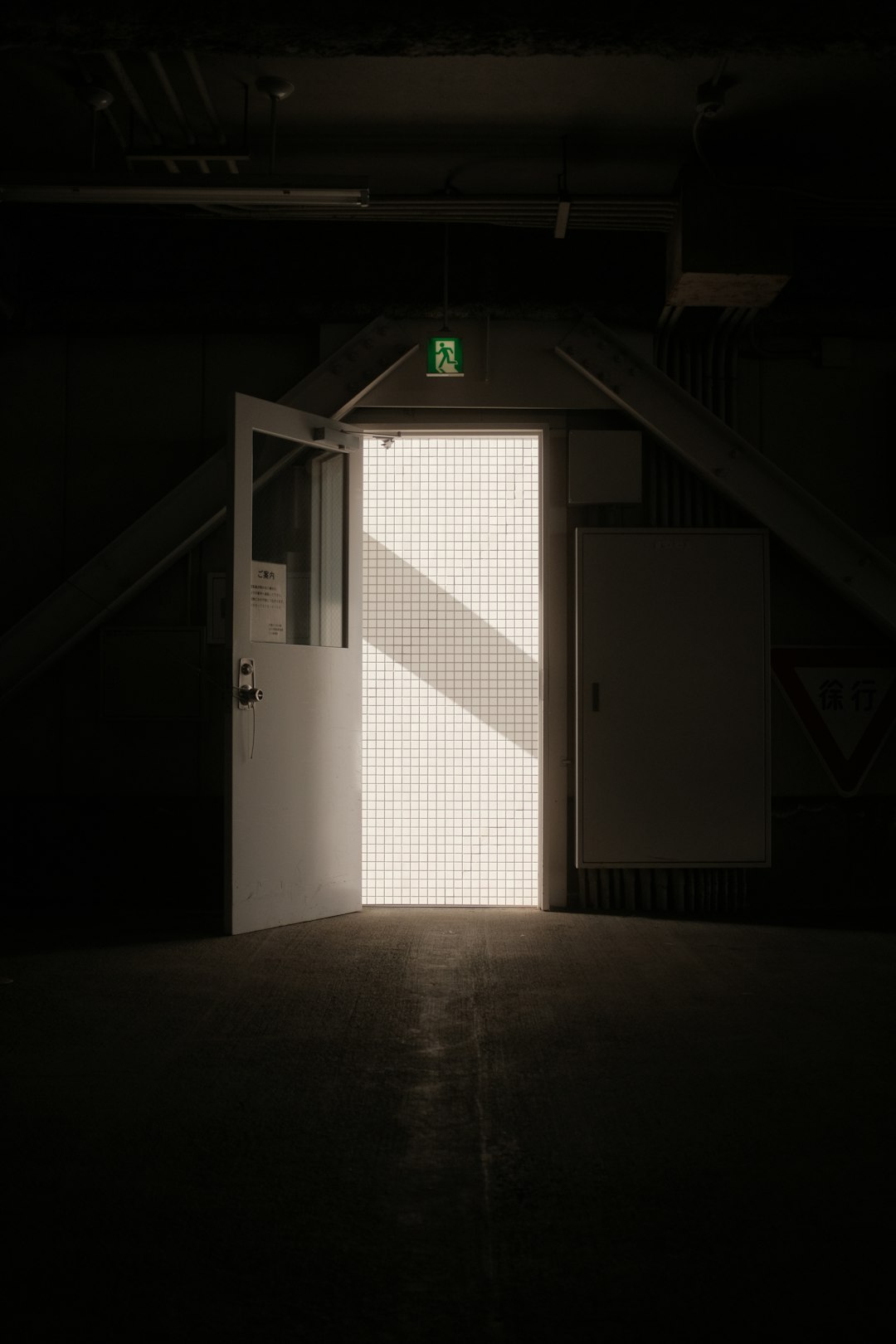 white wooden door in a dark room