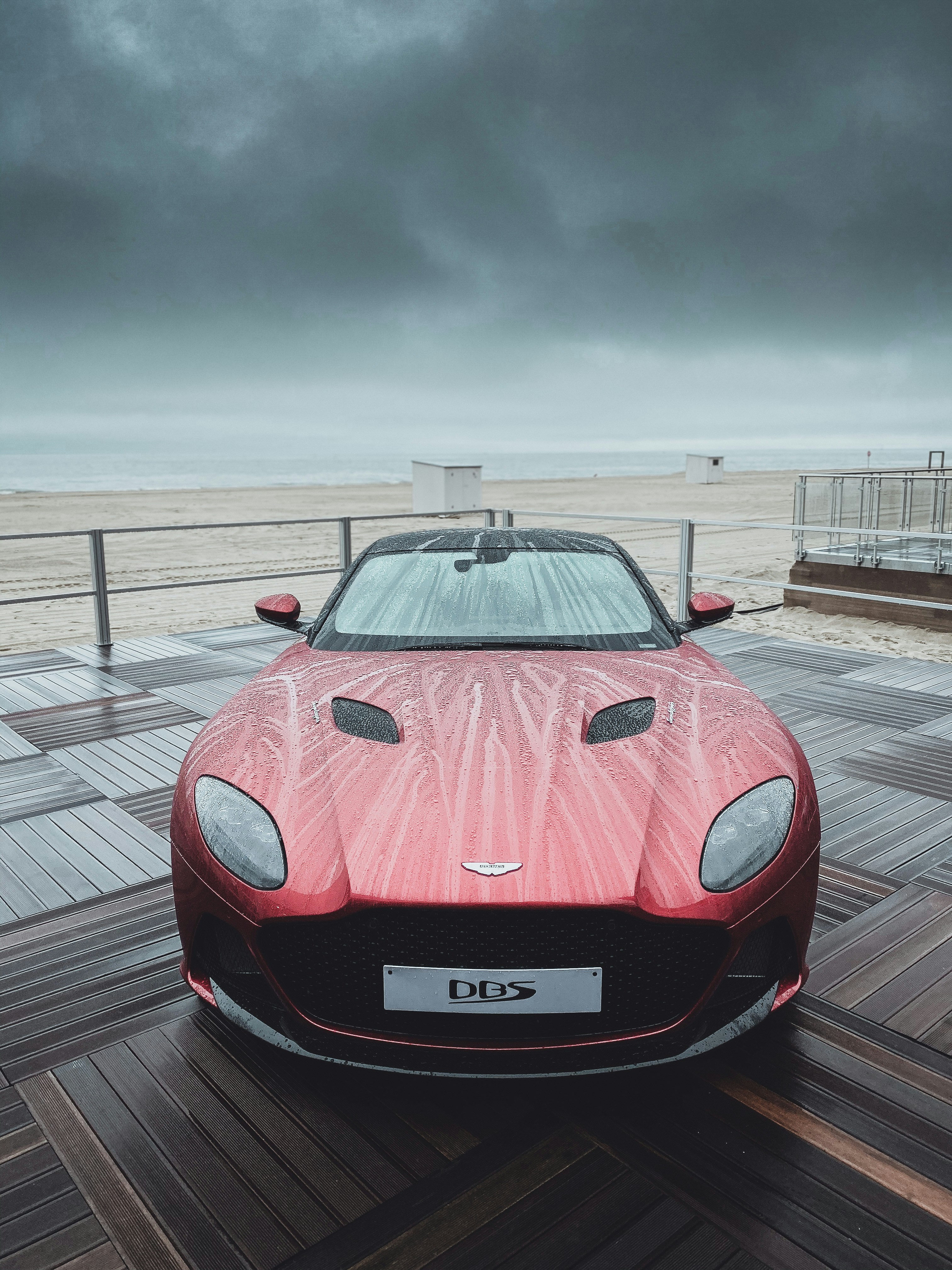 red ferrari sports car on road during daytime