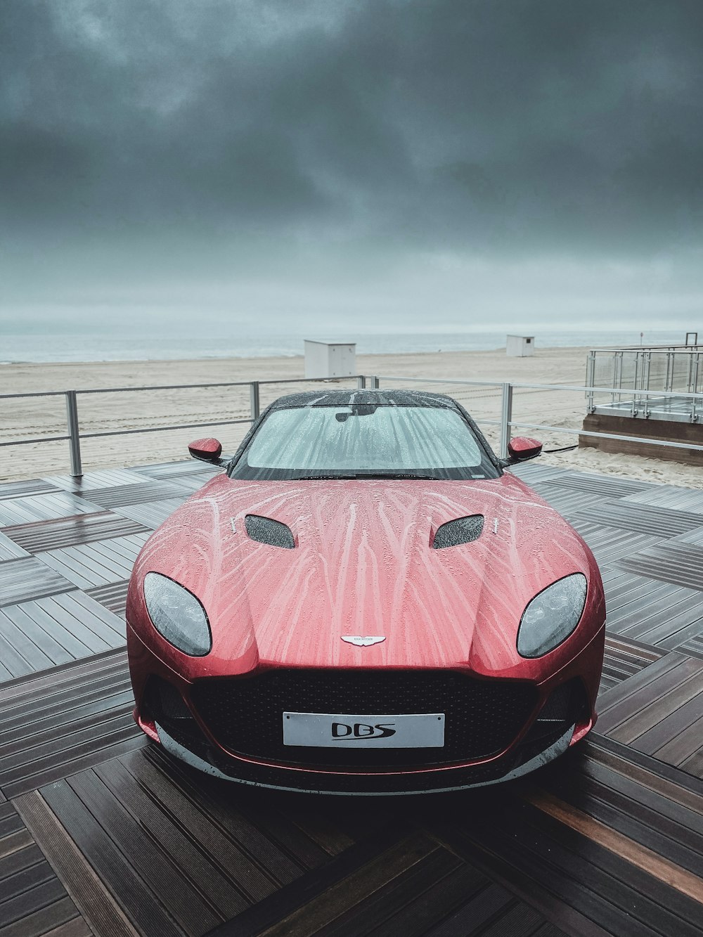 red ferrari sports car on road during daytime