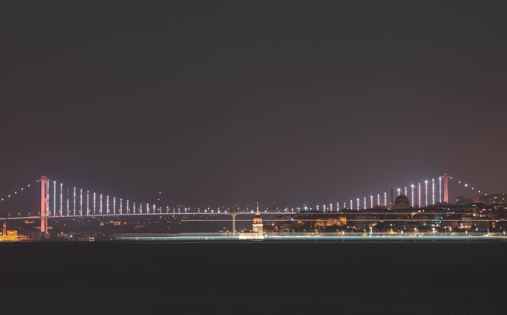 bridge over water during night time