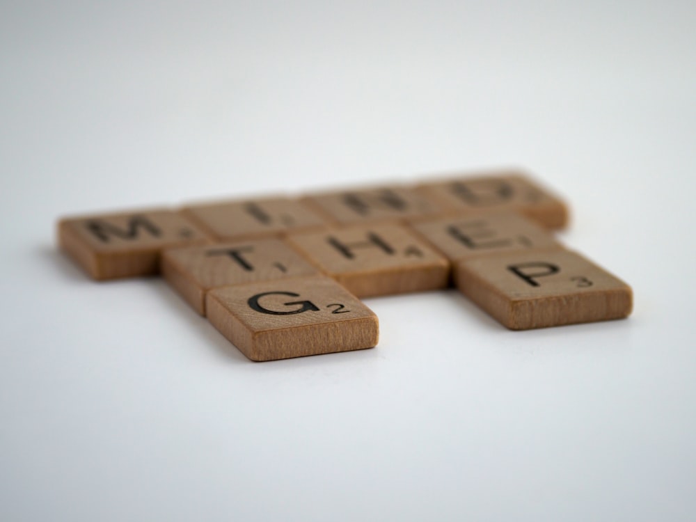 brown wooden letter t-letter
