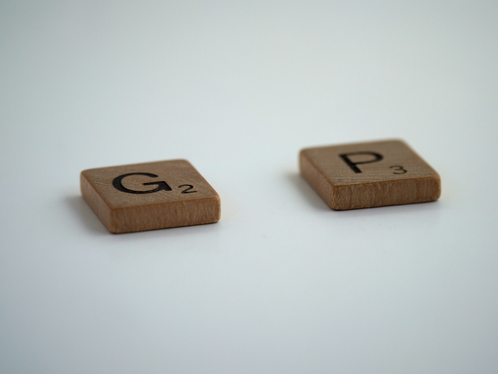scrabble, scrabble pieces, lettering, letters, wood, scrabble tiles, white background, words, type, typography, design, layout, incomplete, imperfect, not finished, finish, lacking, omit, gap, hole, lacuna, mind the gap, 
