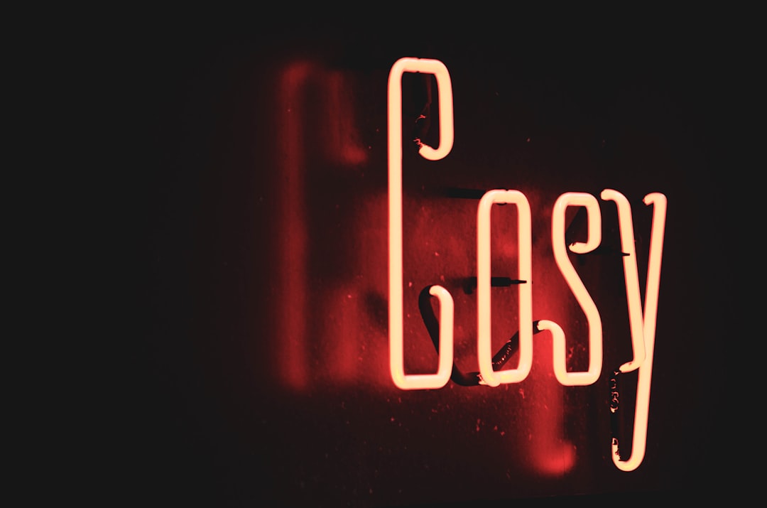 red and white love neon light signage, <em></figure>Chuckles while tucked in bed.</em>