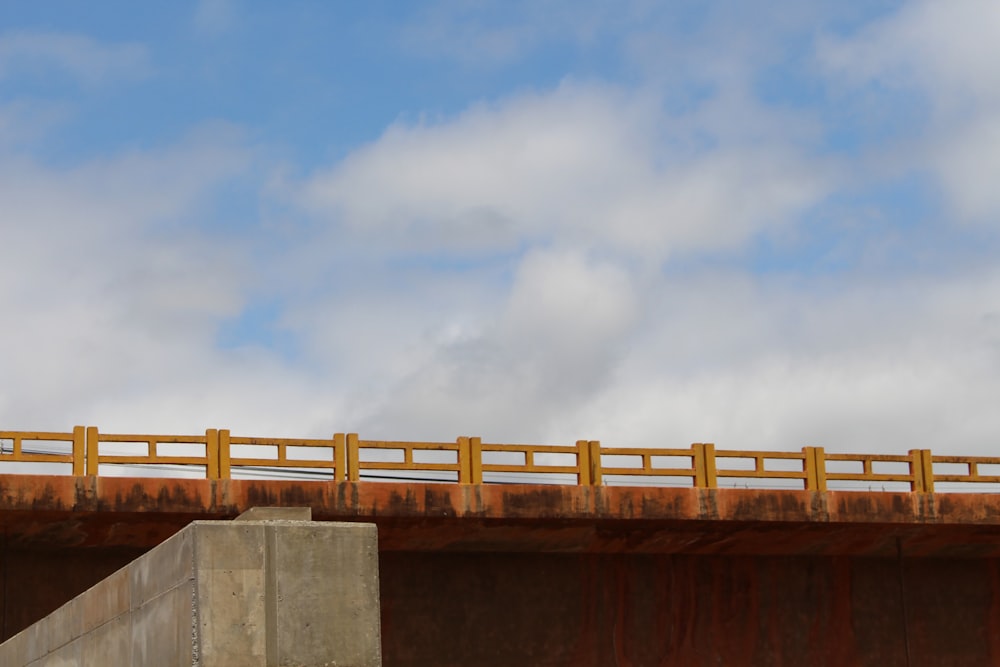 brown wooden fence under blue sky during daytime