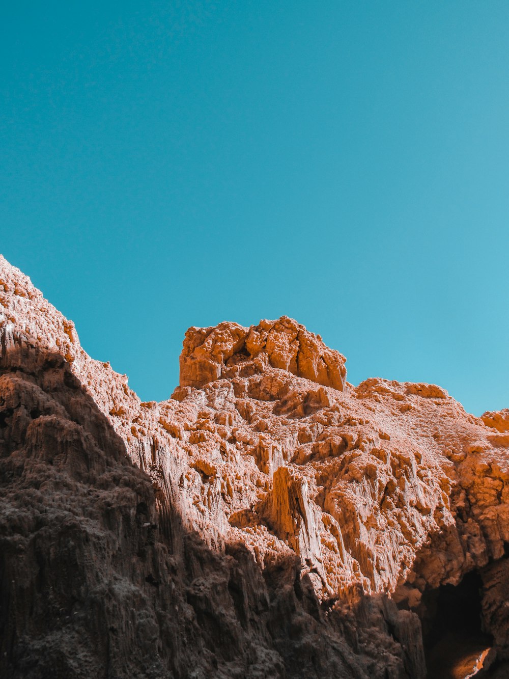 brown rock formation under blue sky during daytime