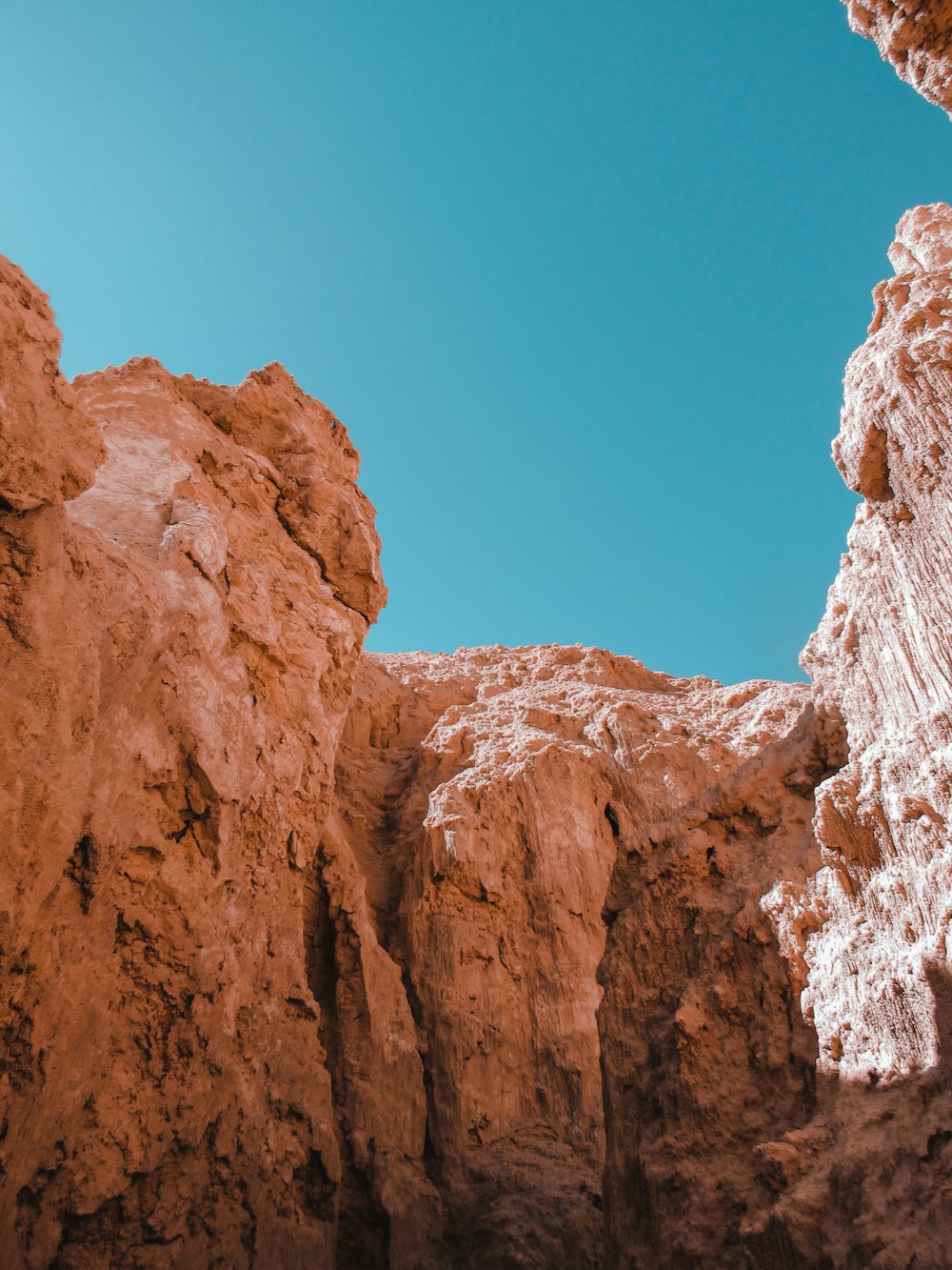 brown rocky mountain under blue sky during daytime