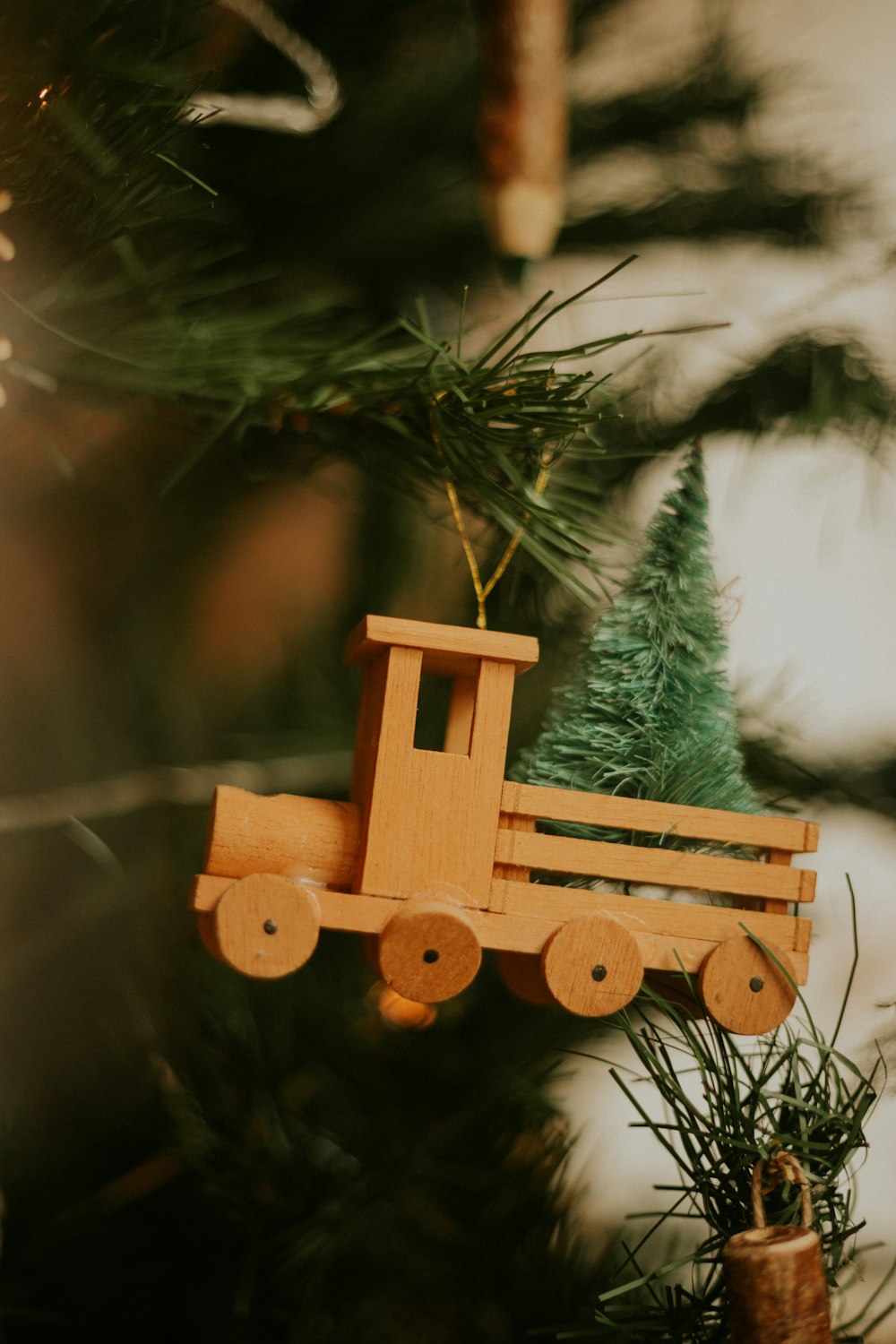 brown wooden dog toy on green christmas tree