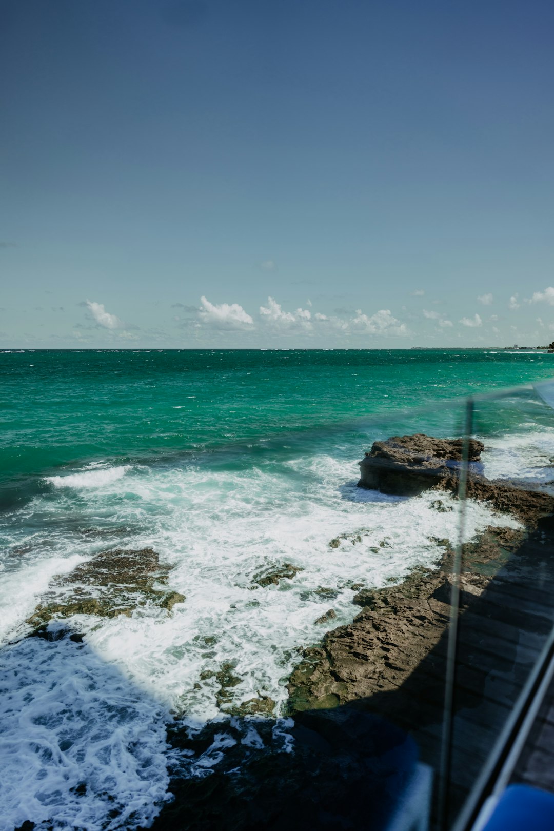 ocean waves crashing on shore during daytime