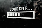 A white loading bar with five filled segments on a black wall