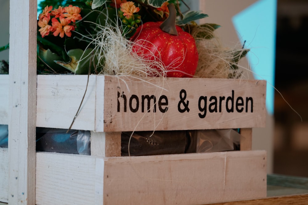 red and yellow flowers on brown wooden crate