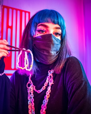 woman in black long sleeve shirt wearing mask