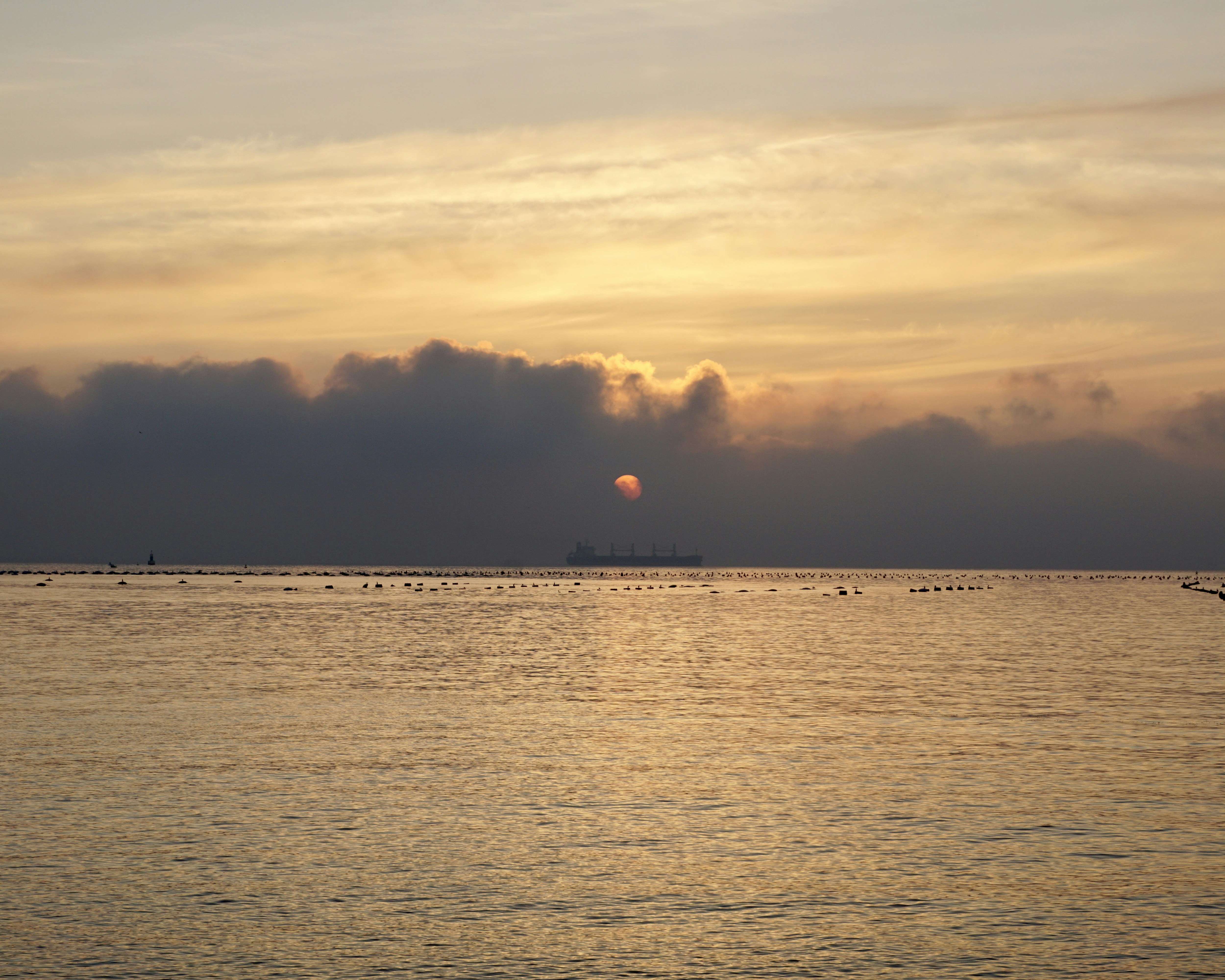 body of water during sunset