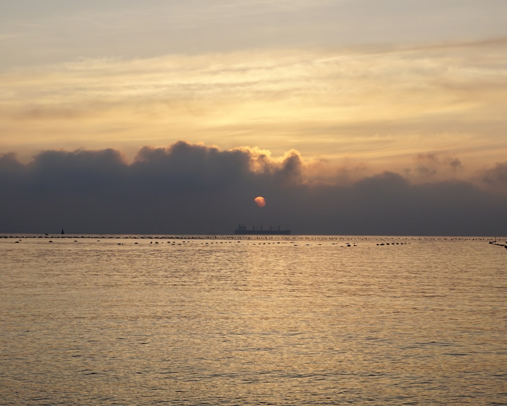 body of water during sunset