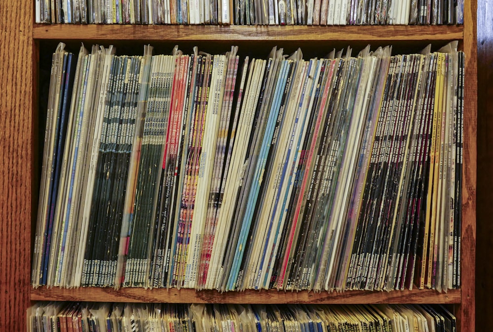 books on brown wooden shelf