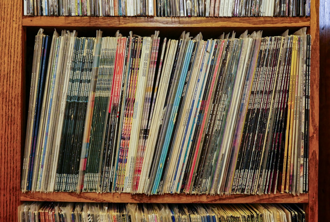 books on brown wooden shelf