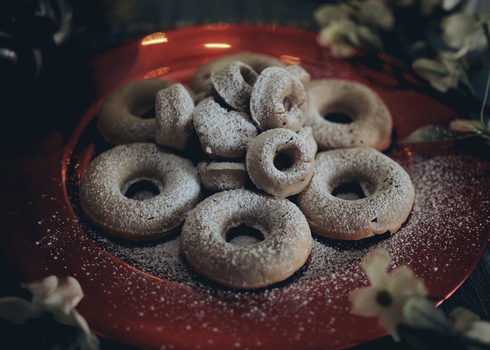 brown donuts on red ceramic plate