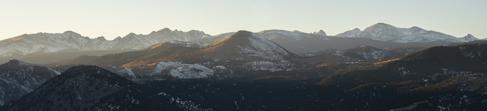 brown and black mountains under blue sky during daytime