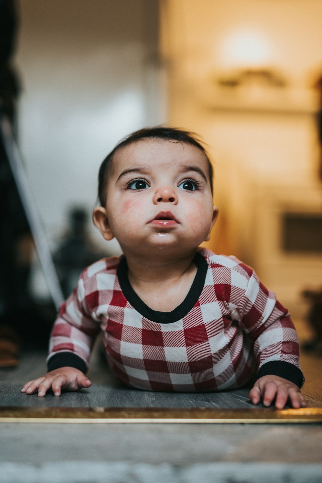 boy in red and white striped long sleeve shirt