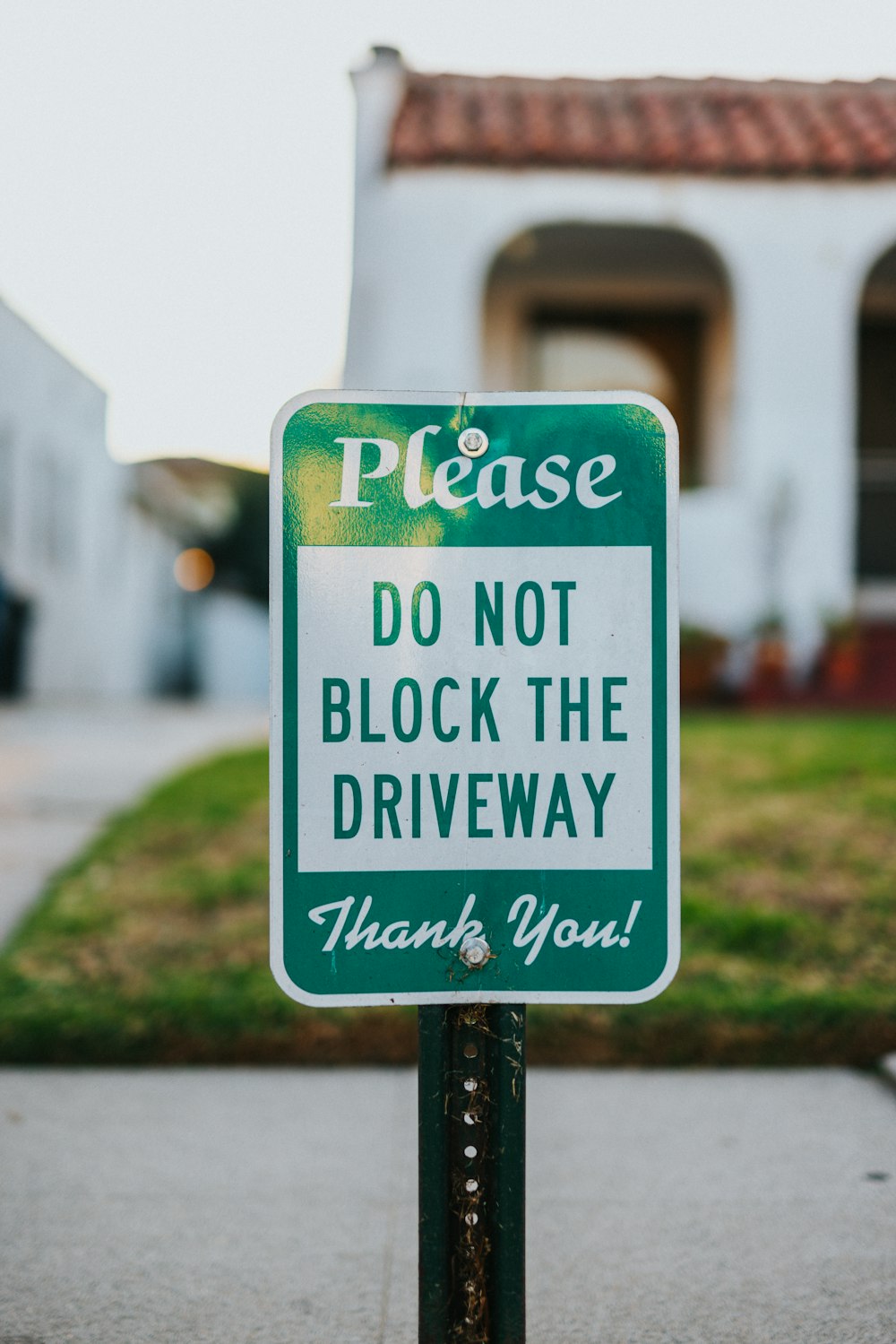 white and green street sign