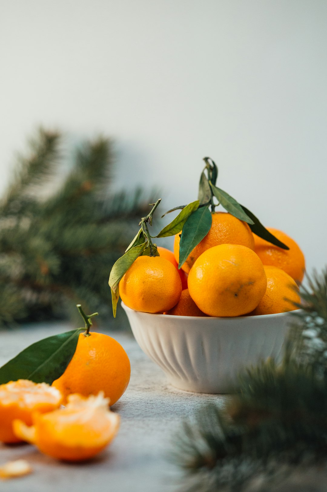 orange fruits on white ceramic bowl