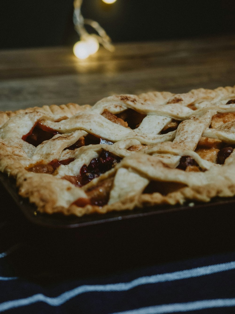 brown and white pie on black tray