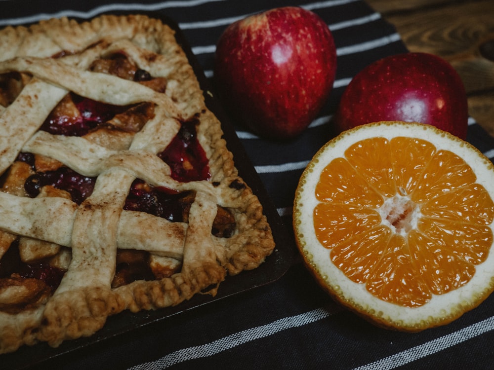 sliced orange fruit on black tray