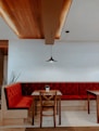 red and brown wooden chairs and table