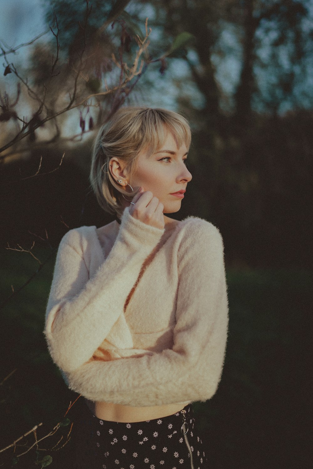 girl in white sweater smiling