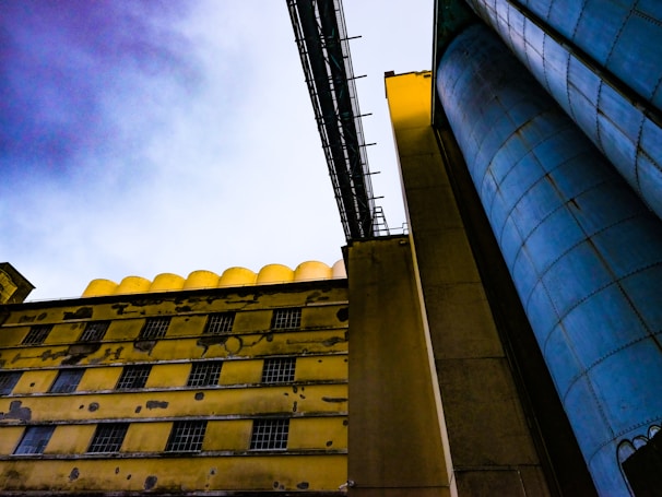 A panoramic view of the Halcyon Steel Homes factory with rows of modular steel house components ready for assembly.