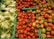 Close-up of vibrant vegetables neatly arranged in crates at the market.