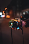 person holding black and silver nikon dslr camera