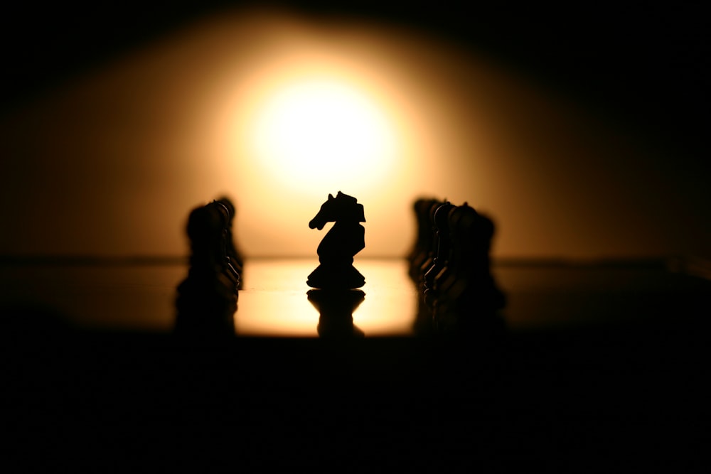 a group of chess pieces sitting on top of a table