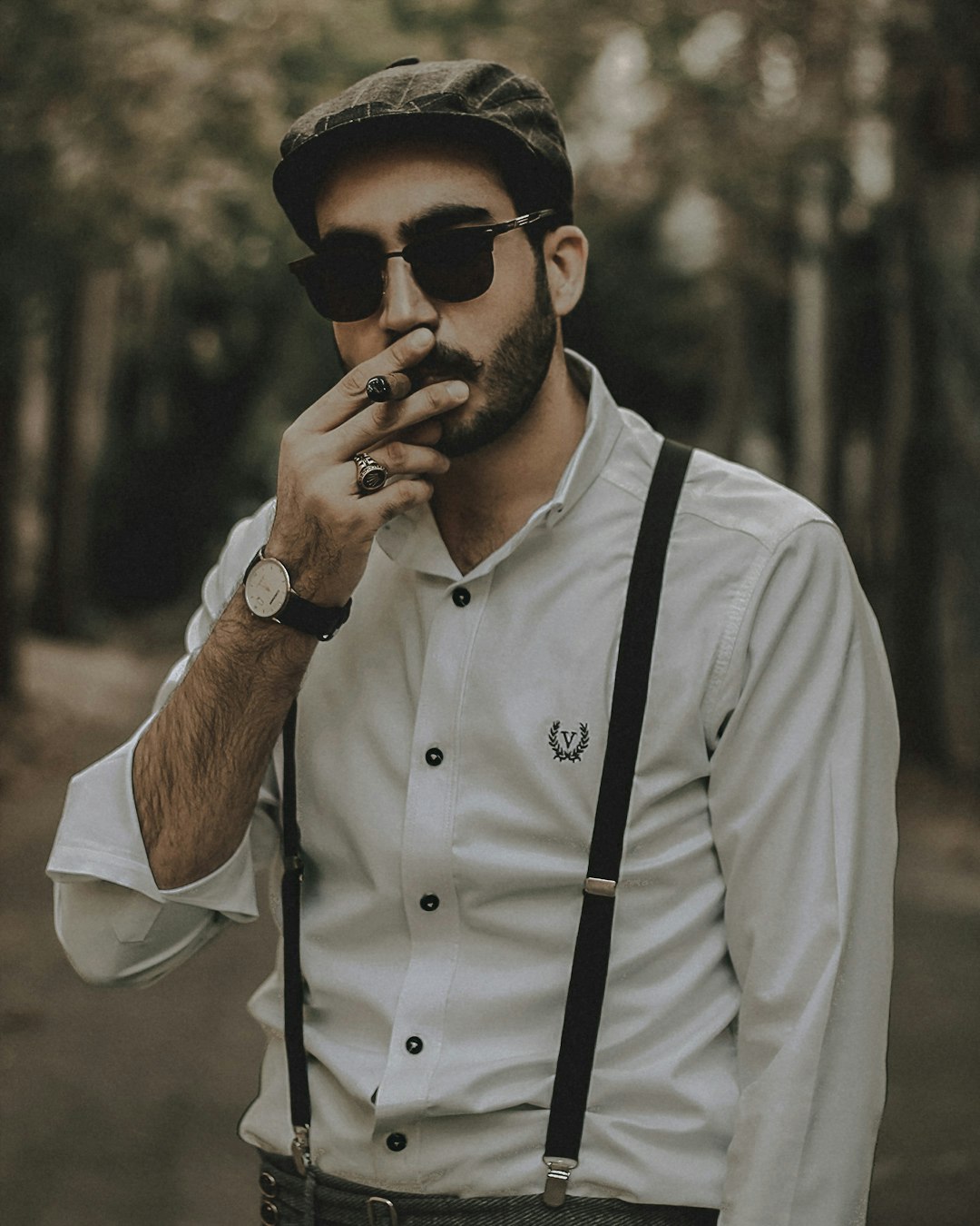 man in white dress shirt wearing black sunglasses