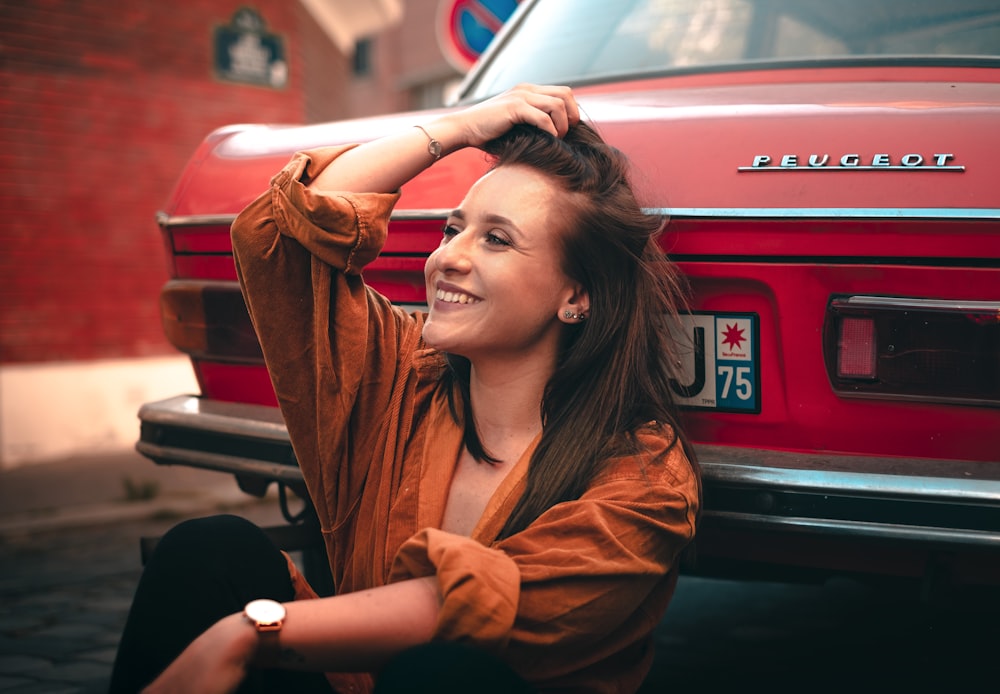 woman in brown coat smiling