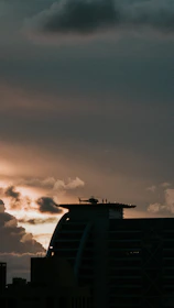 A completed helipad at sunset with a helicopter landing smoothly.