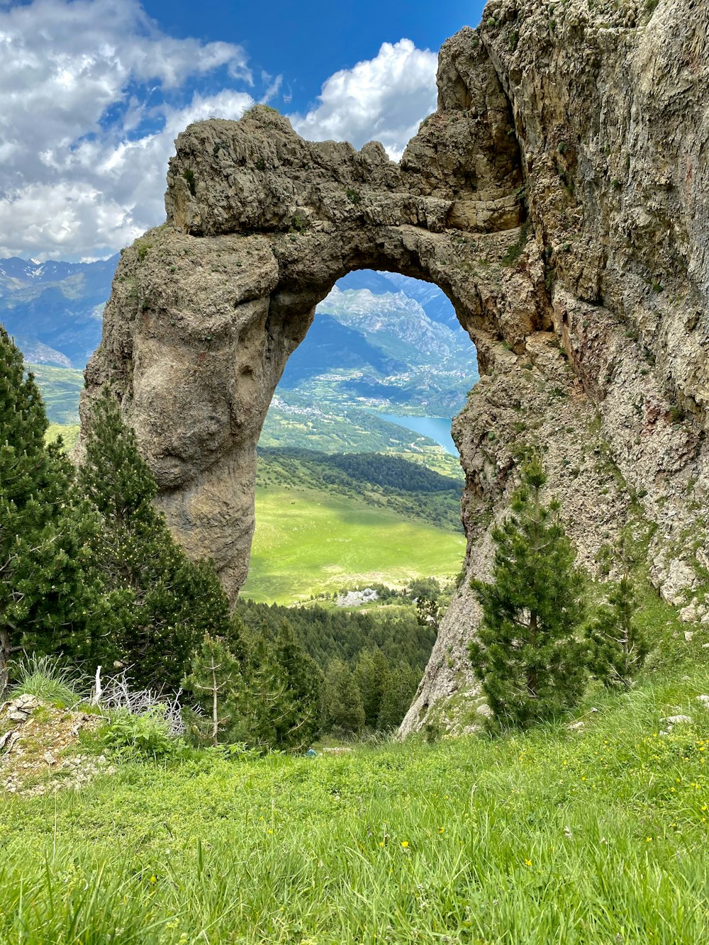 a rock formation with a hole in the middle of it