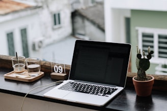 macbook pro on white table