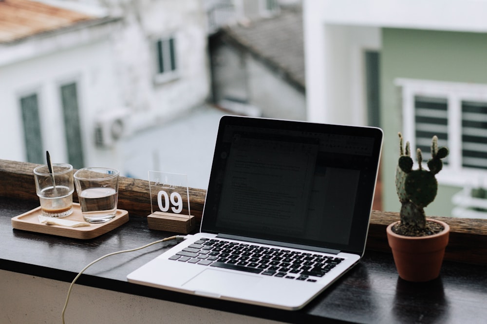 macbook pro on white table