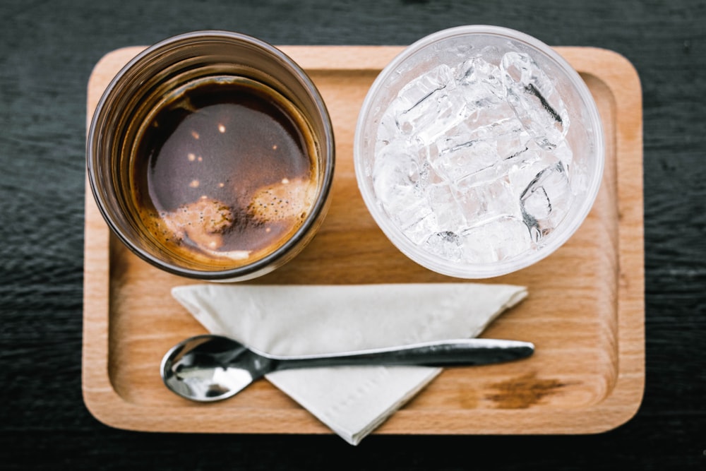 stainless steel fork beside clear glass jar