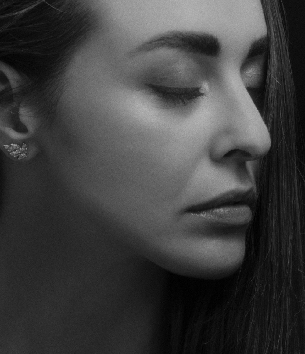 woman with silver stud earrings