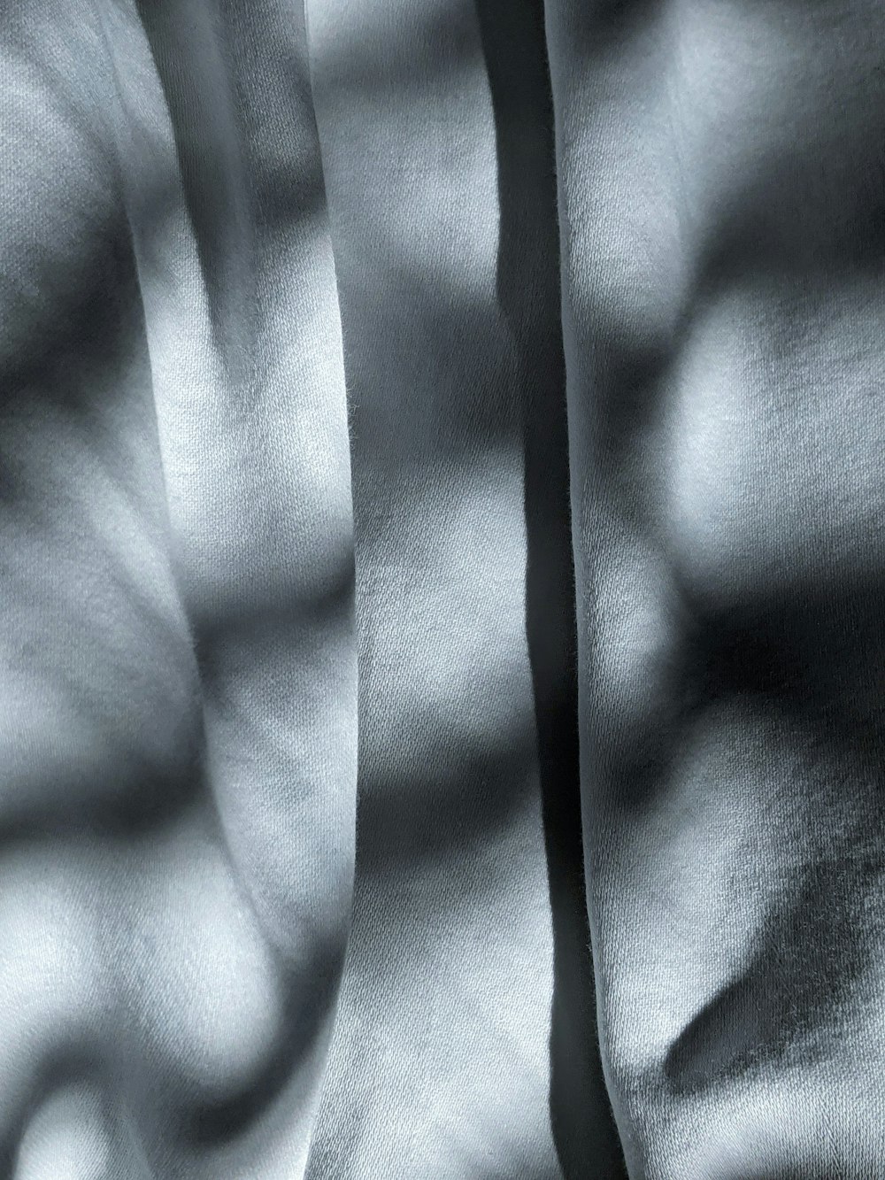 black textile on white textile