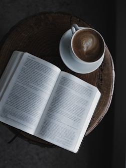 white book page on brown wooden table