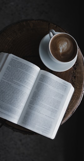 white book page on brown wooden table