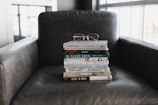 assorted books on black couch