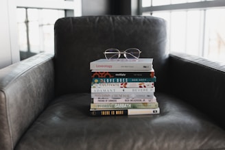 assorted books on black couch