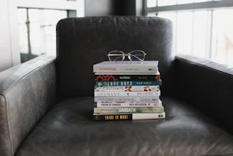 assorted books on black couch