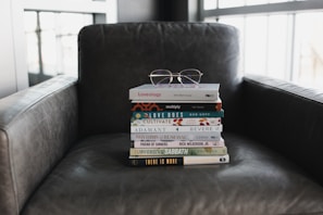 assorted books on black couch